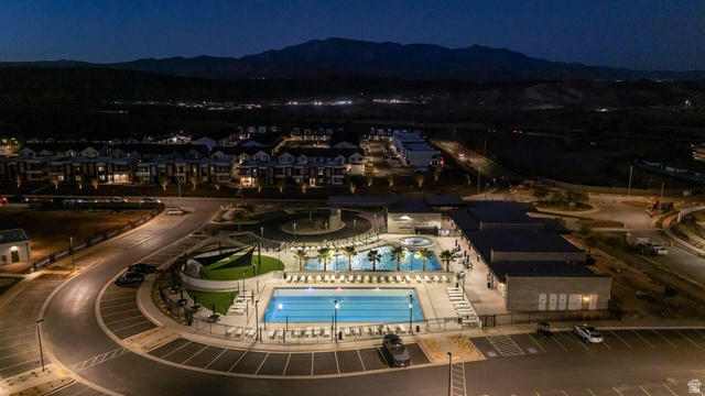 2216 Wolverine Way Washington, UT 84780 - Photo 25 of 29 Community recreation area featuring multiple pools, spa, and mature palm trees
