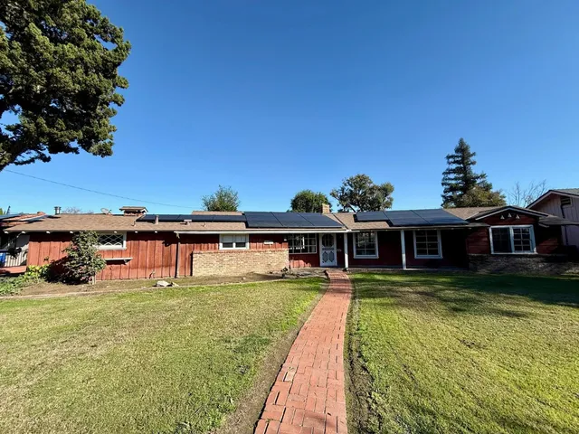 a view of a house with a swimming pool