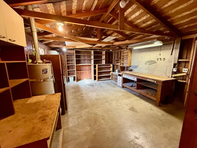 a view of a room with wooden furniture