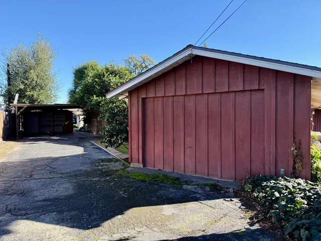 a view of a backyard with potted plants