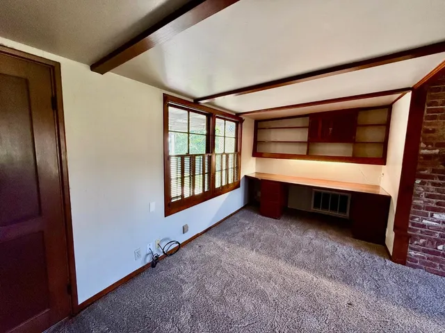 a room with furniture and a window