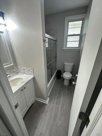 a bathroom with a sink toilet and tub