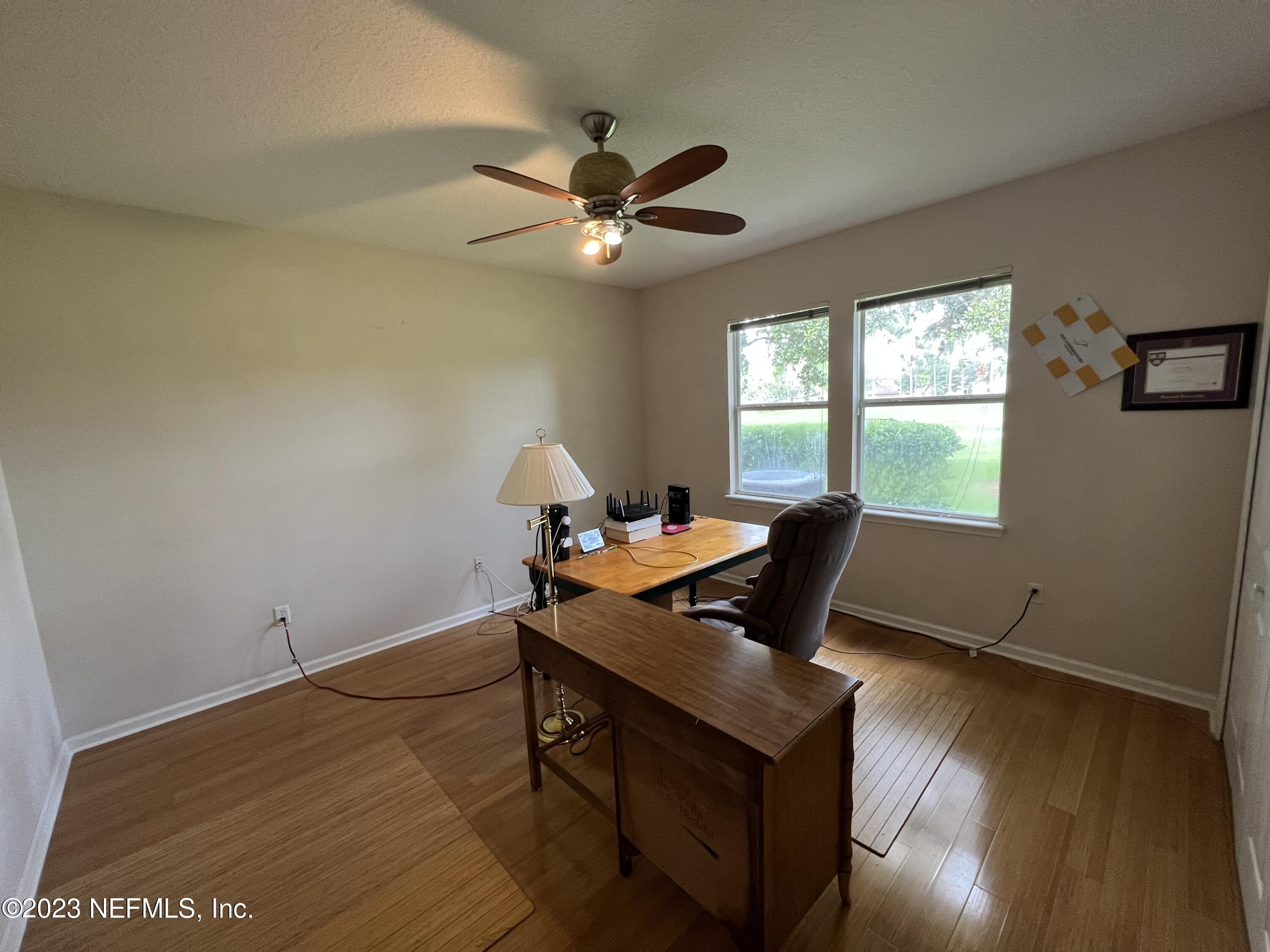 2406 Golfview Drive Fleming Island, FL 32003 - Photo 15 of 28 a workspace with wooden floor and a window