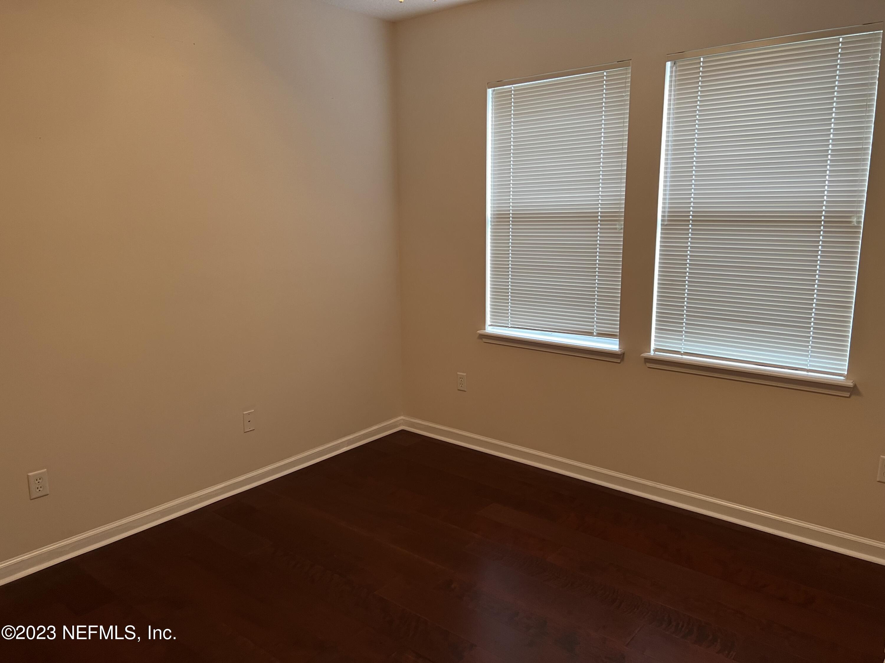 2406 Golfview Drive Fleming Island, FL 32003 - Photo 17 of 28 a view of a room with wooden floor and a window