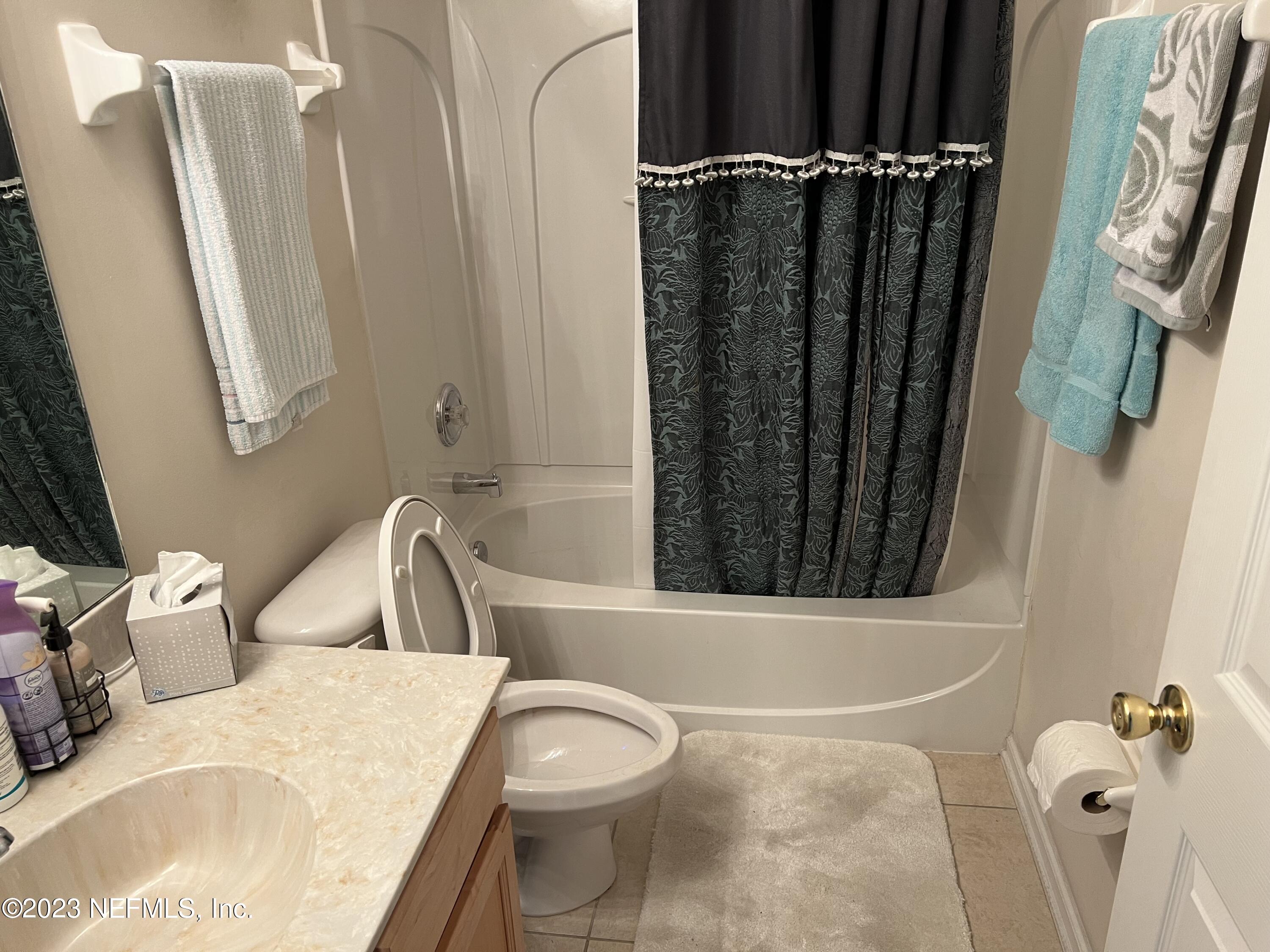 2406 Golfview Drive Fleming Island, FL 32003 - Photo 18 of 28 a bathroom with a sink a toilet a tub and shower