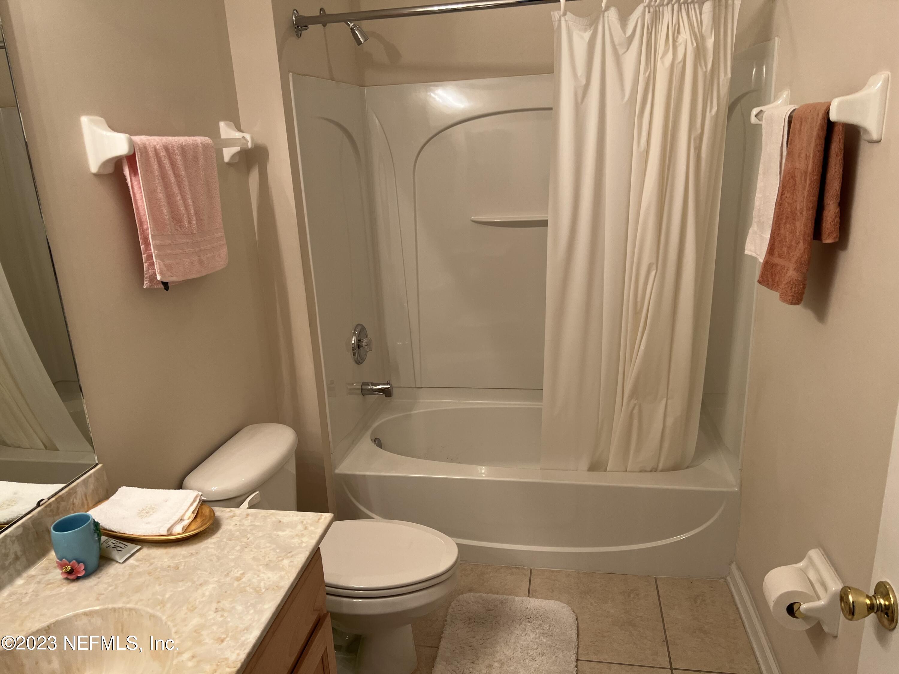 2406 Golfview Drive Fleming Island, FL 32003 - Photo 19 of 28 a bathroom with a sink toilet and shower