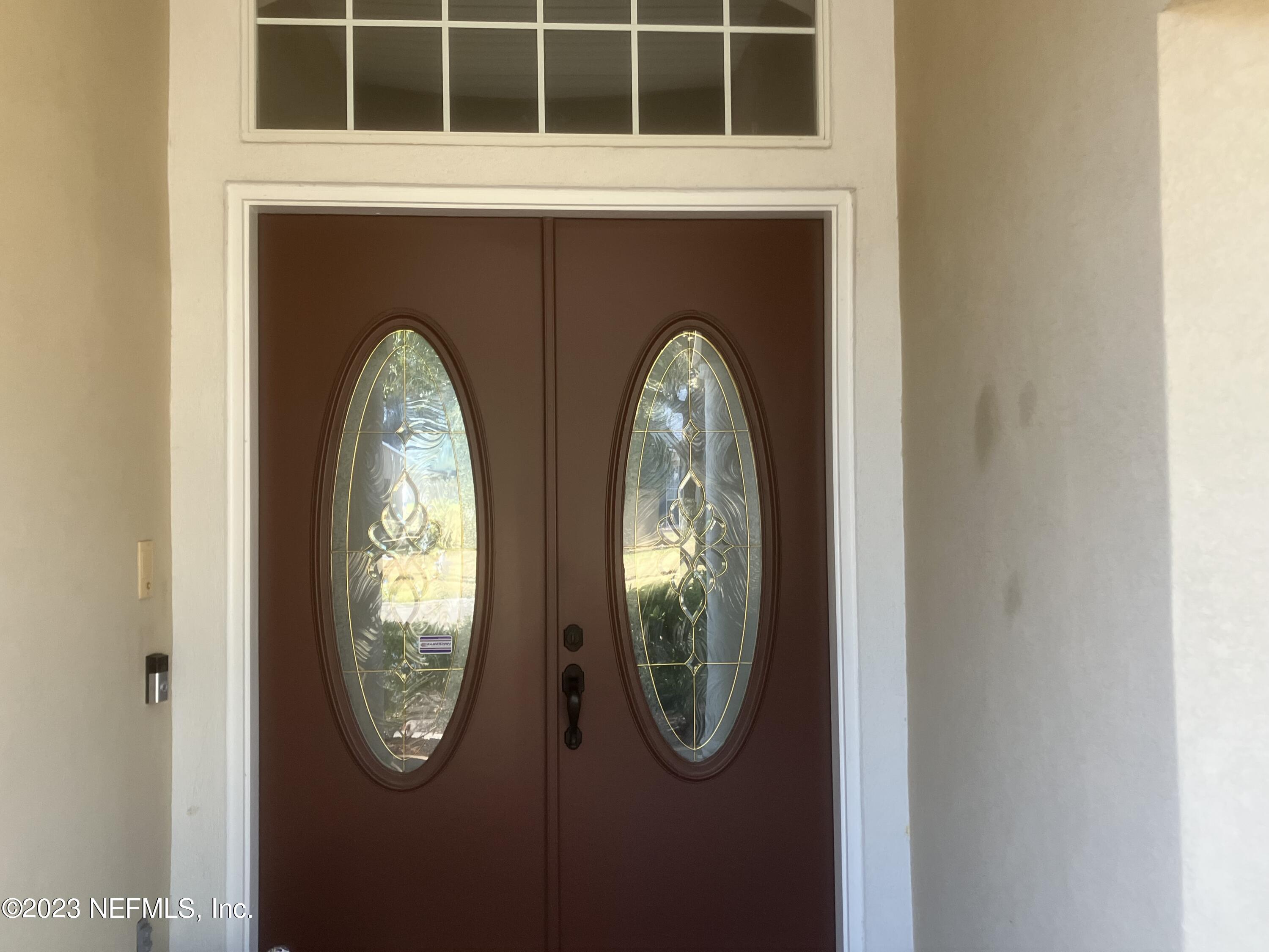 2406 Golfview Drive Fleming Island, FL 32003 - Photo 20 of 28 a view of a livingroom with wooden floor and a window