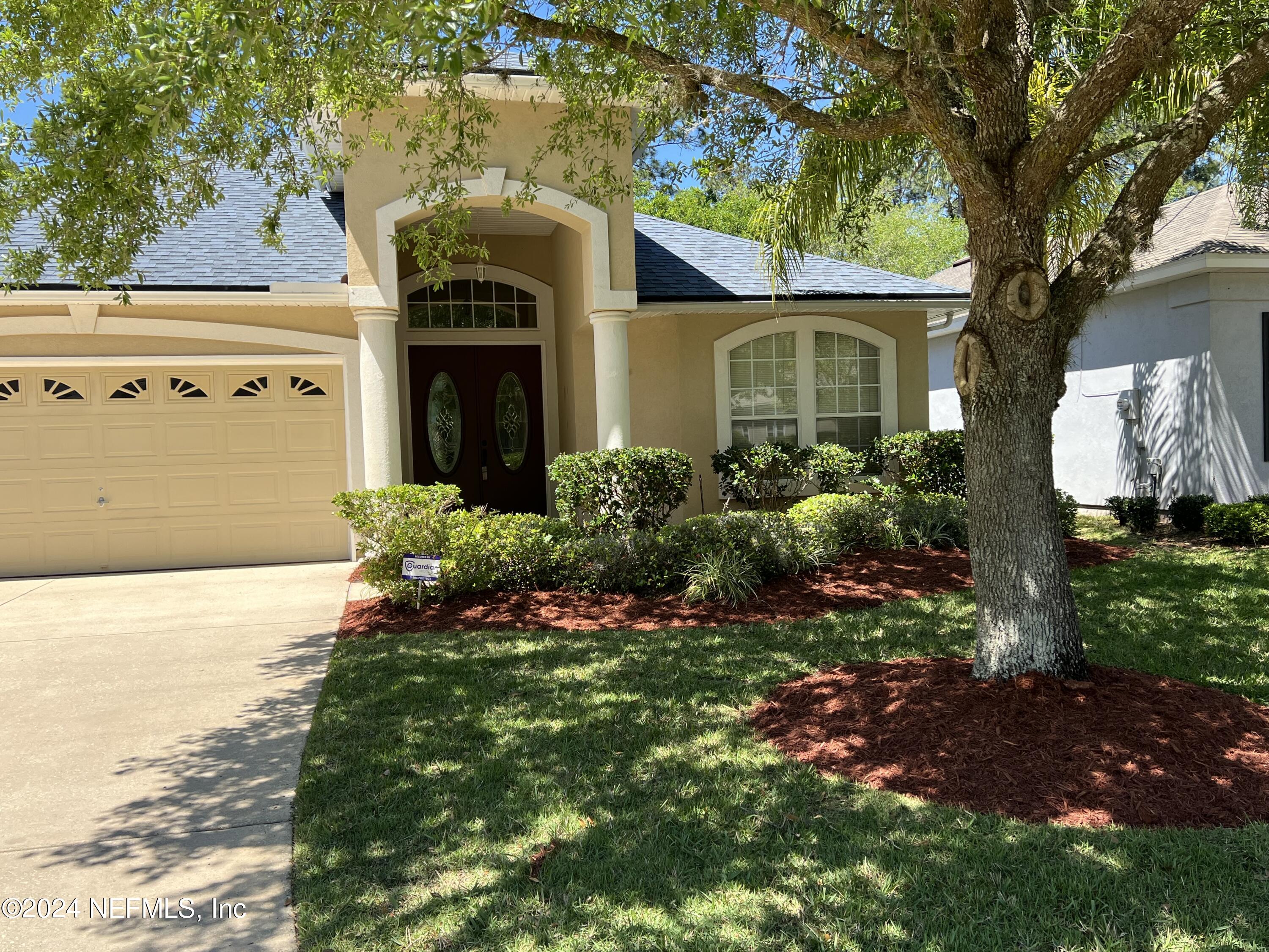 2406 Golfview Drive Fleming Island, FL 32003 - Photo 26 of 28 a front view of a house with a yard
