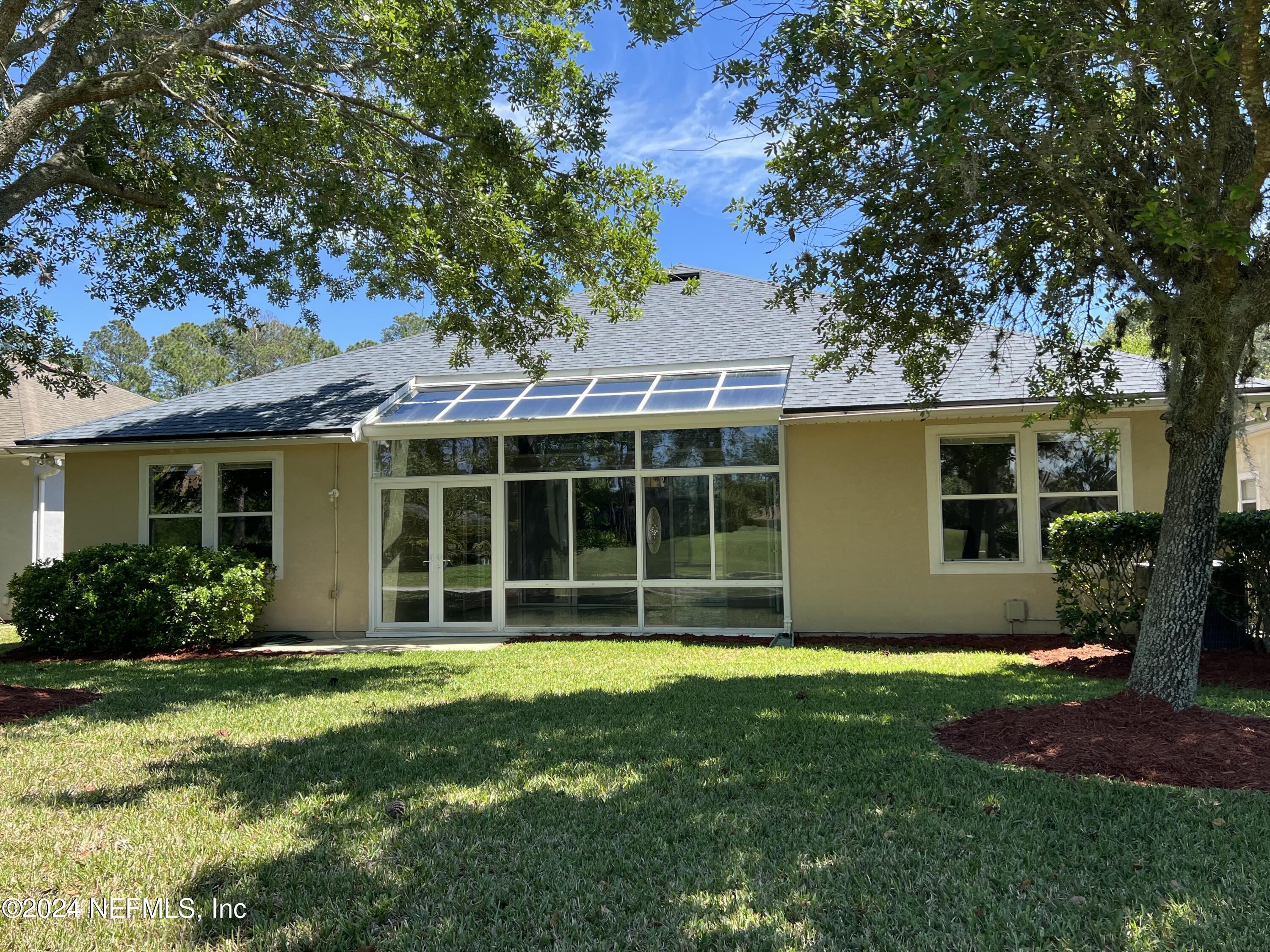 2406 Golfview Drive Fleming Island, FL 32003 - Photo 4 of 28 front view of a house with a yard