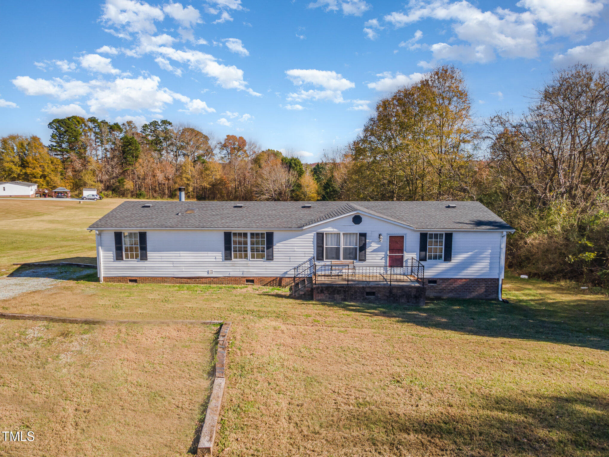 155 Kermit Duncan Road Timberlake, NC 27583 - Photo 1 of 16 a front view of a house with a yard
