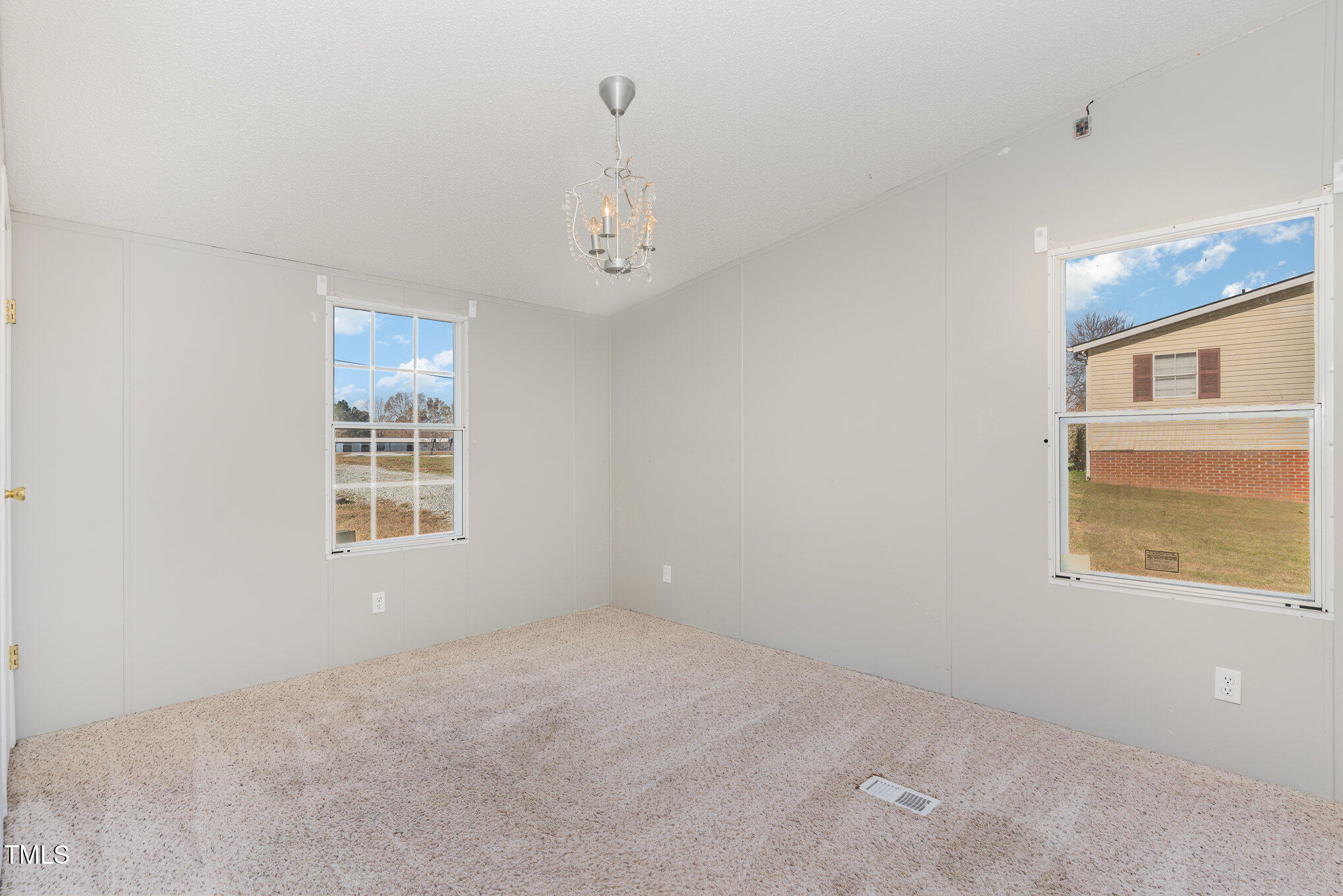 155 Kermit Duncan Road Timberlake, NC 27583 - Photo 8 of 16 a view of an empty room with a window