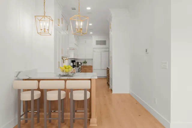 a dining room with furniture and chandelier