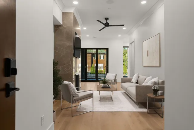 a living room with furniture and a large window