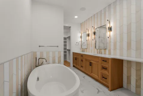 a bathroom with a double vanity sink and mirror