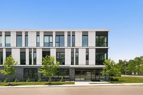 a view of a building with a garden