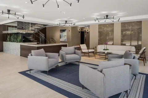 a view of a hallway with seating area