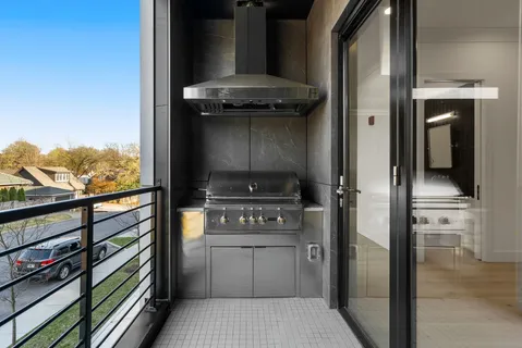 a kitchen with a refrigerator and a stove