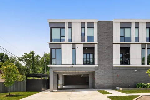a view of a hallway with seating space