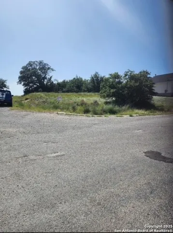 a view of a lake with houses in the back