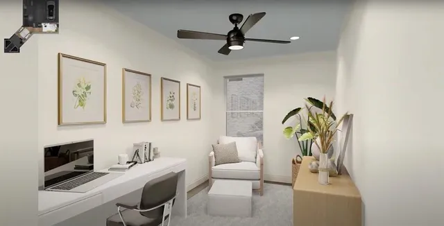 a living room with furniture and a ceiling fan