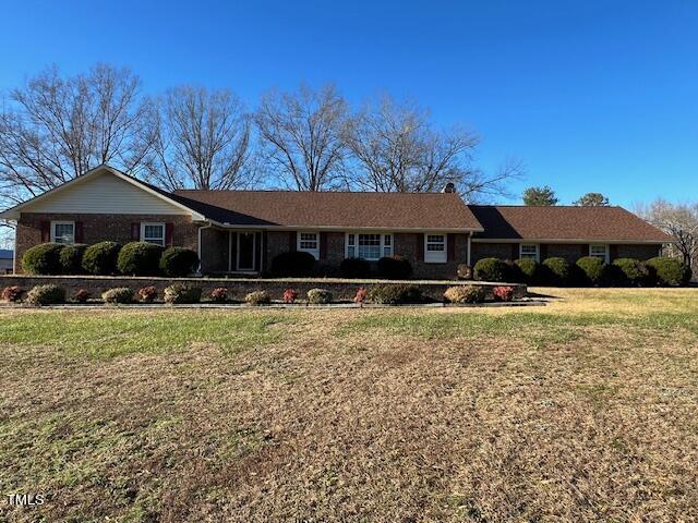 971 Rock Spring Church Road Henderson, NC 27537 - Photo 1 of 39 a front view of a house with a yard
