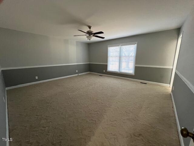 971 Rock Spring Church Road Henderson, NC 27537 - Photo 13 of 39 an empty room with windows and fan