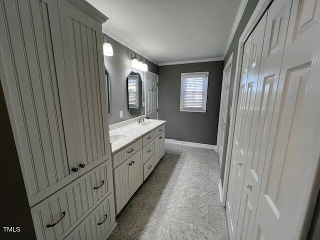971 Rock Spring Church Road Henderson, NC 27537 - Photo 16 of 39 a bathroom with a double vanity sink and mirror