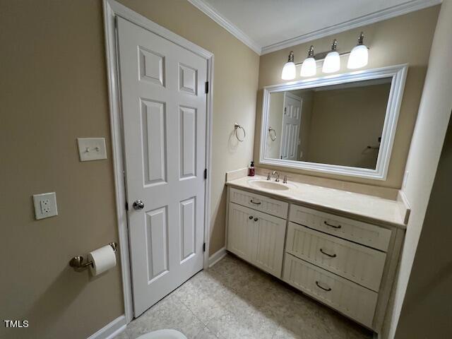 971 Rock Spring Church Road Henderson, NC 27537 - Photo 22 of 39 a bathroom with a double vanity sink and mirror