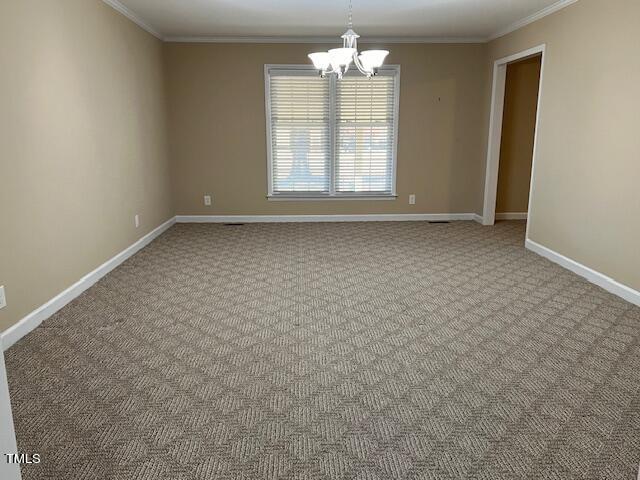 971 Rock Spring Church Road Henderson, NC 27537 - Photo 6 of 39 an empty room with a window
