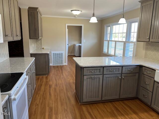 971 Rock Spring Church Road Henderson, NC 27537 - Photo 8 of 39 a kitchen with stainless steel appliances granite countertop wooden cabinets a stove a sink and a hard wood floors