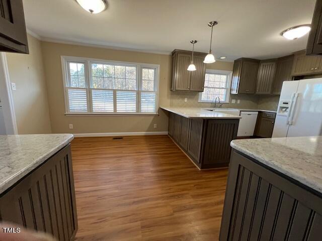 971 Rock Spring Church Road Henderson, NC 27537 - Photo 10 of 39 a large kitchen with granite countertop a sink a counter space and wooden floor