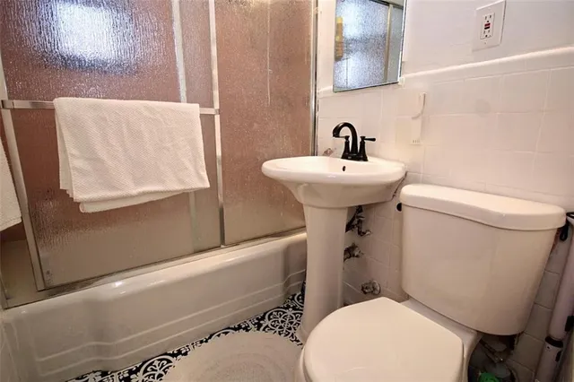 a view of a workspace with furniture and wooden floor