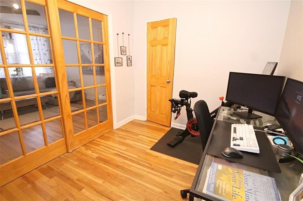 7259 Shore Road, Unit 5A Brooklyn, NY 11209 - Photo 17 of 18 a view of workspace with wooden floor windows