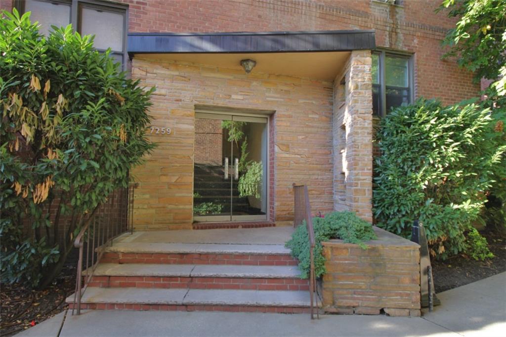 7259 Shore Road, Unit 5A Brooklyn, NY 11209 - Photo 3 of 18 a front view of a house with potted plants