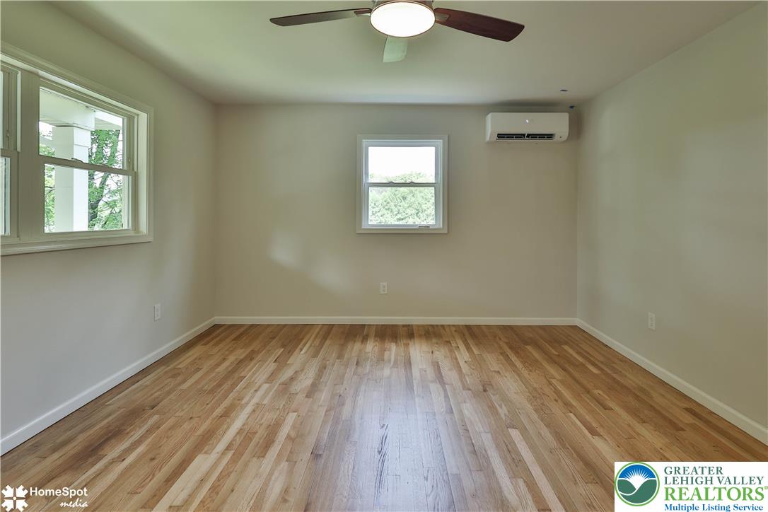 919 Point Phillips Road Bath, PA 18014 - Photo 31 of 59 Well-lit room features gleaming hardwood floors and refreshing ceiling fan.