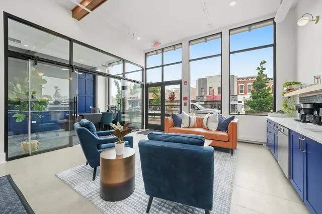 a living room with furniture and a table
