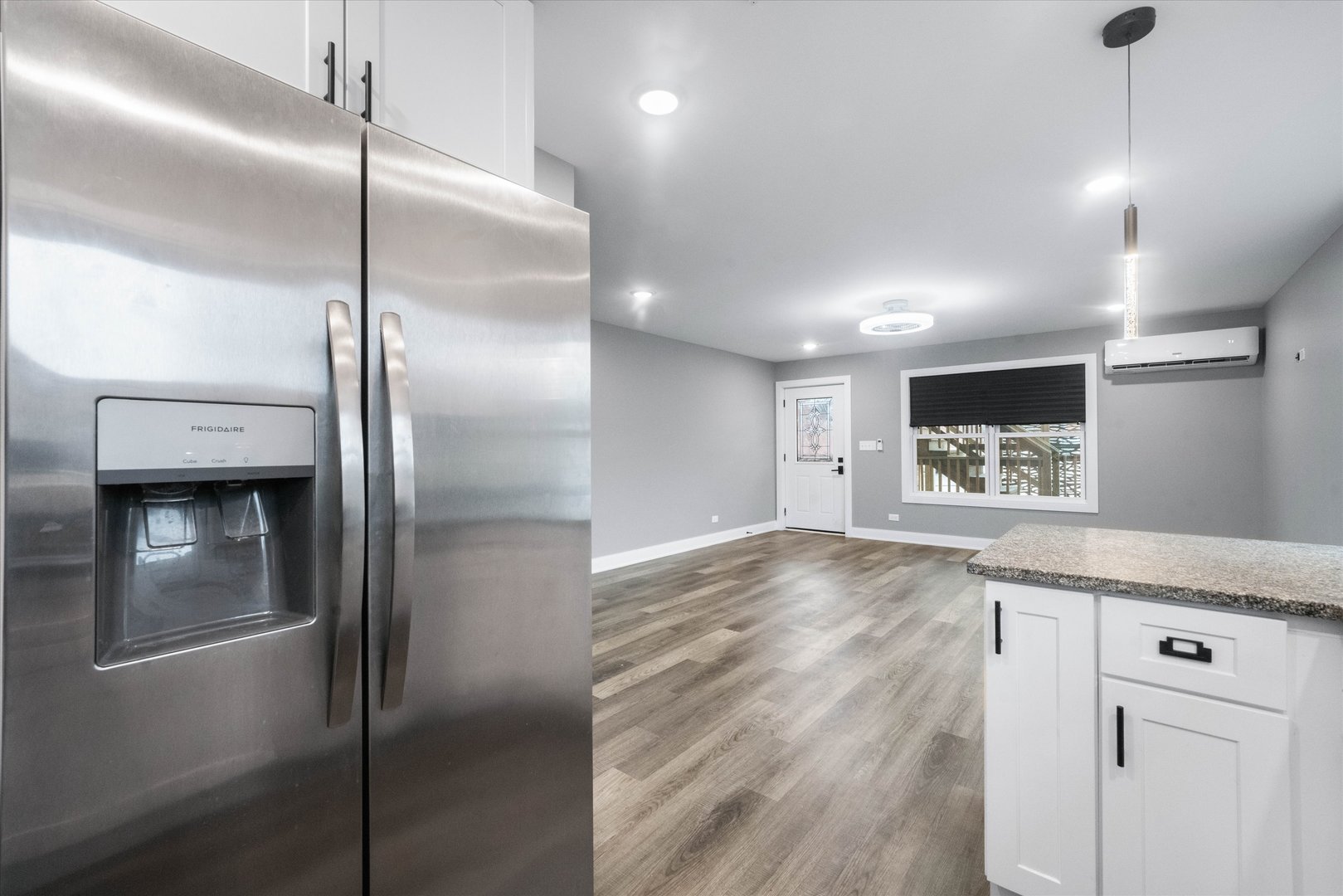 1016 South State Street Lockport, IL 60441 - Photo 37 of 67 a view of a refrigerator in kitchen and an empty room