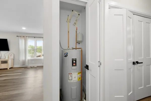 a view of a chairs and table in the backyard of the house