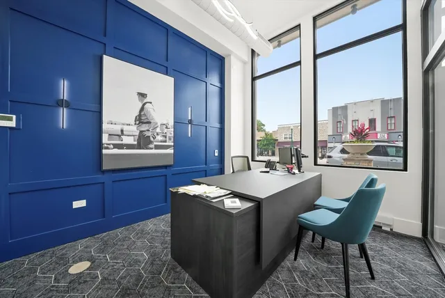 a dining room with furniture and a flat screen tv