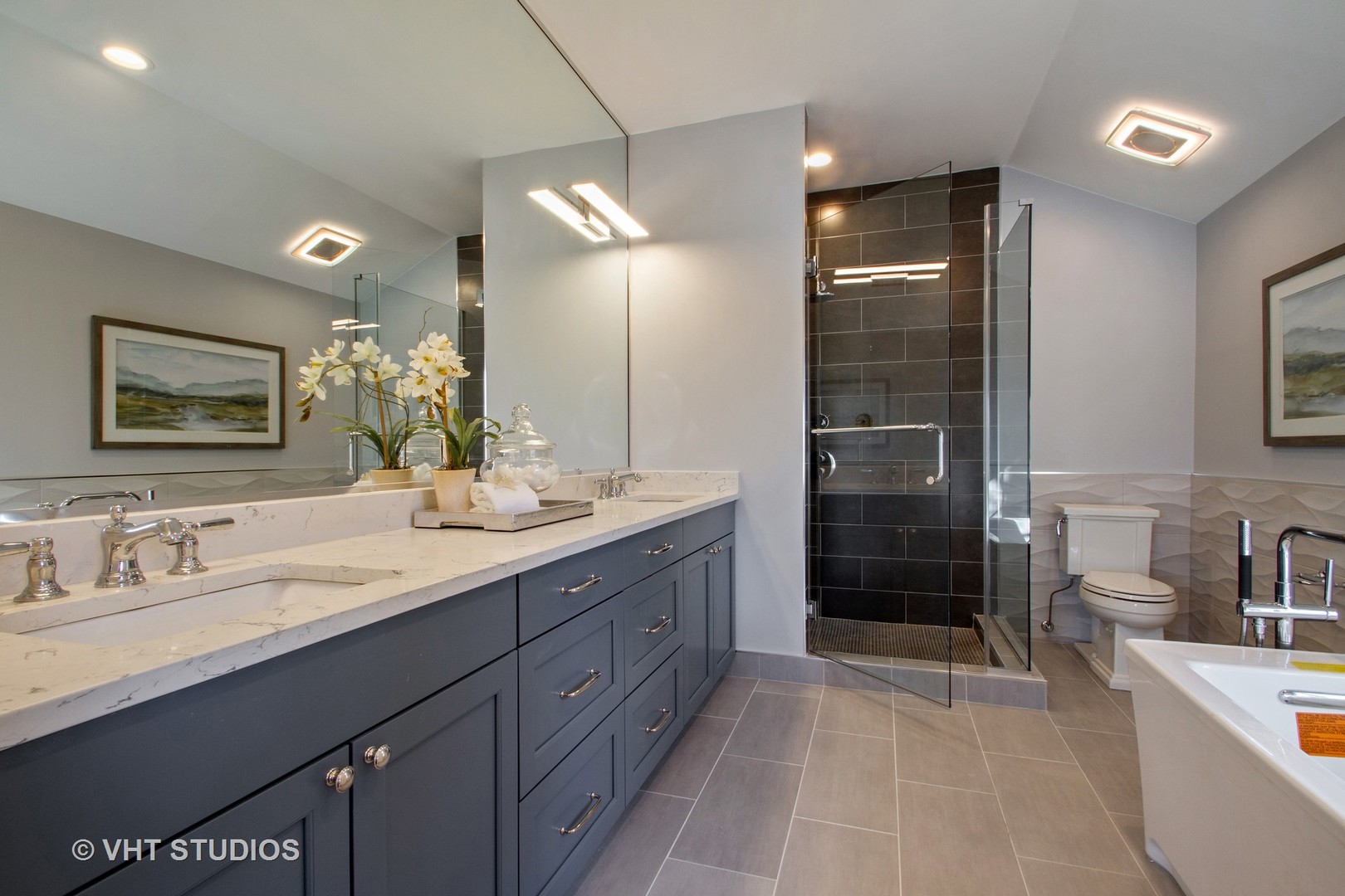 2800 Central Road Glenview, IL 60025 - Photo 11 of 31 a bathroom with a sink a shower a mirror and a bathtub