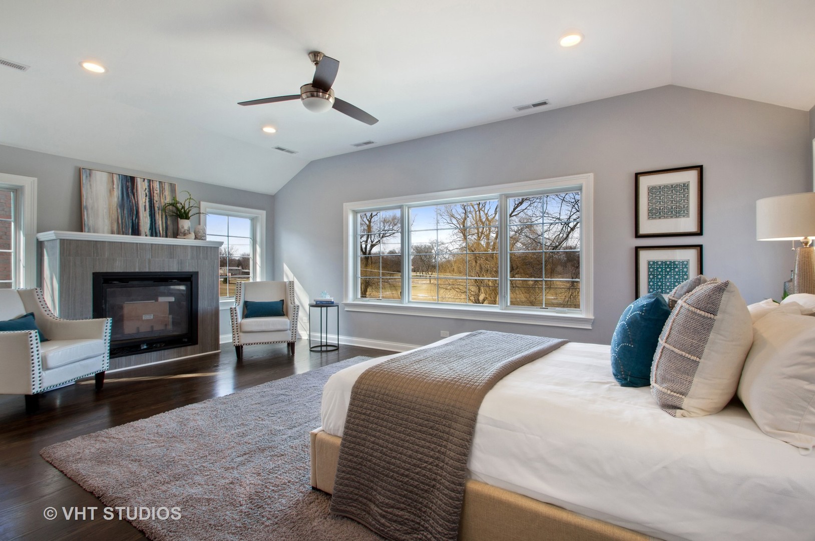 2800 Central Road Glenview, IL 60025 - Photo 10 of 31 a bedroom with a large bed and a fireplace