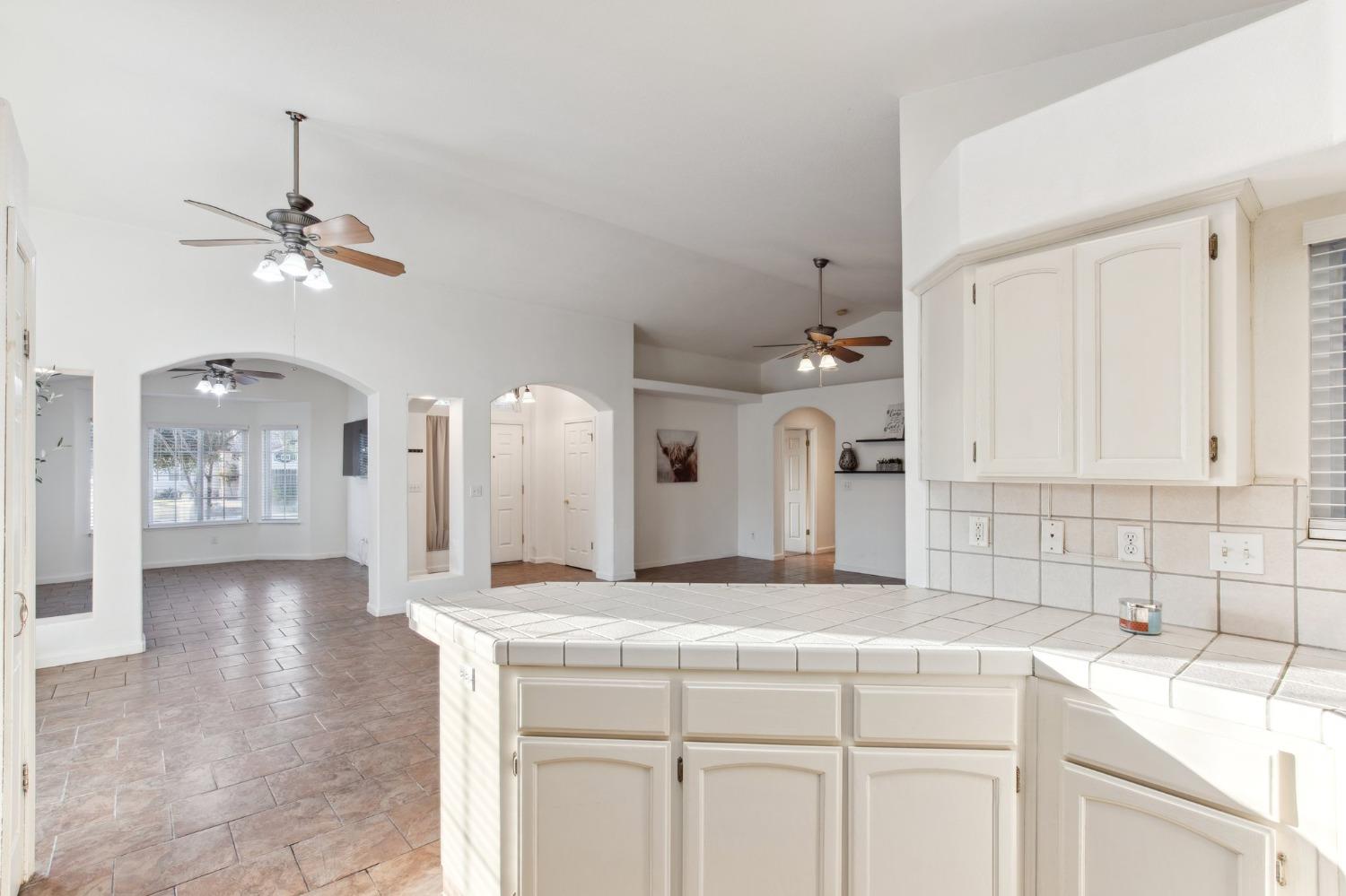 257 Toschi Drive Madera, CA 93637 - Photo 13 of 40 a bathroom with a sink vanity and a mirror