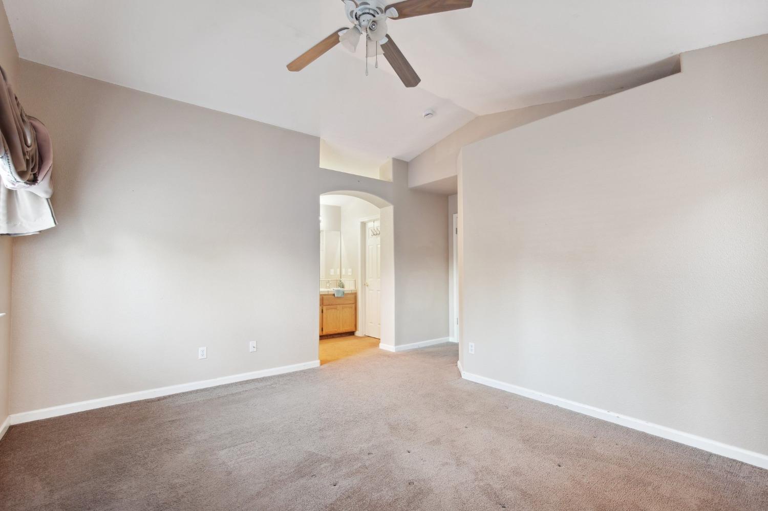 257 Toschi Drive Madera, CA 93637 - Photo 20 of 40 a view of an empty room with a ceiling fan