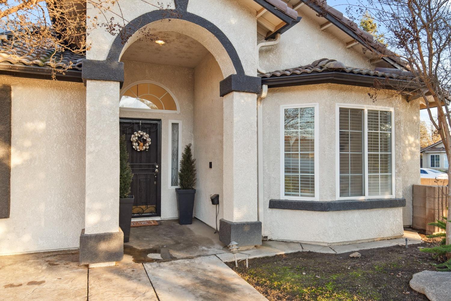 257 Toschi Drive Madera, CA 93637 - Photo 3 of 40 a front view of a house with a yard