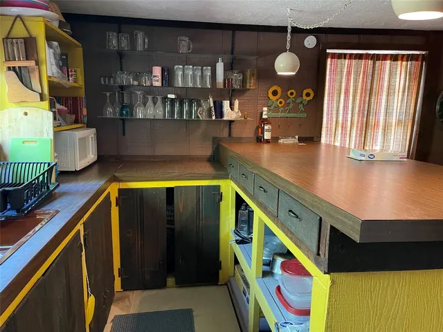 a view of swimming pool with seating area