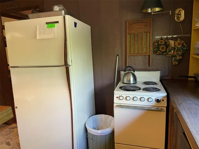 a white refrigerator freezer and a stove