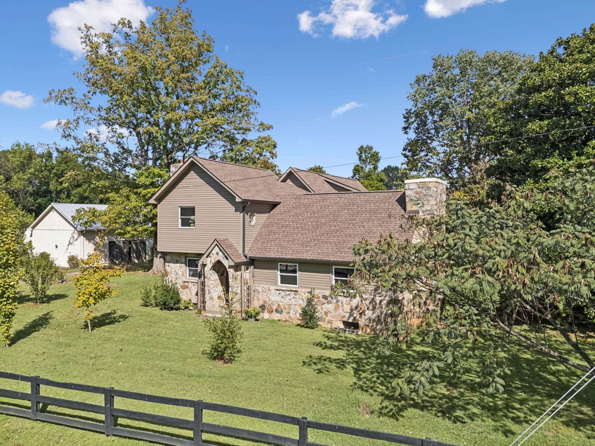 701 Hafner Road Charlotte, TN 37036 - Photo 1 of 52 a front view of a house with garden