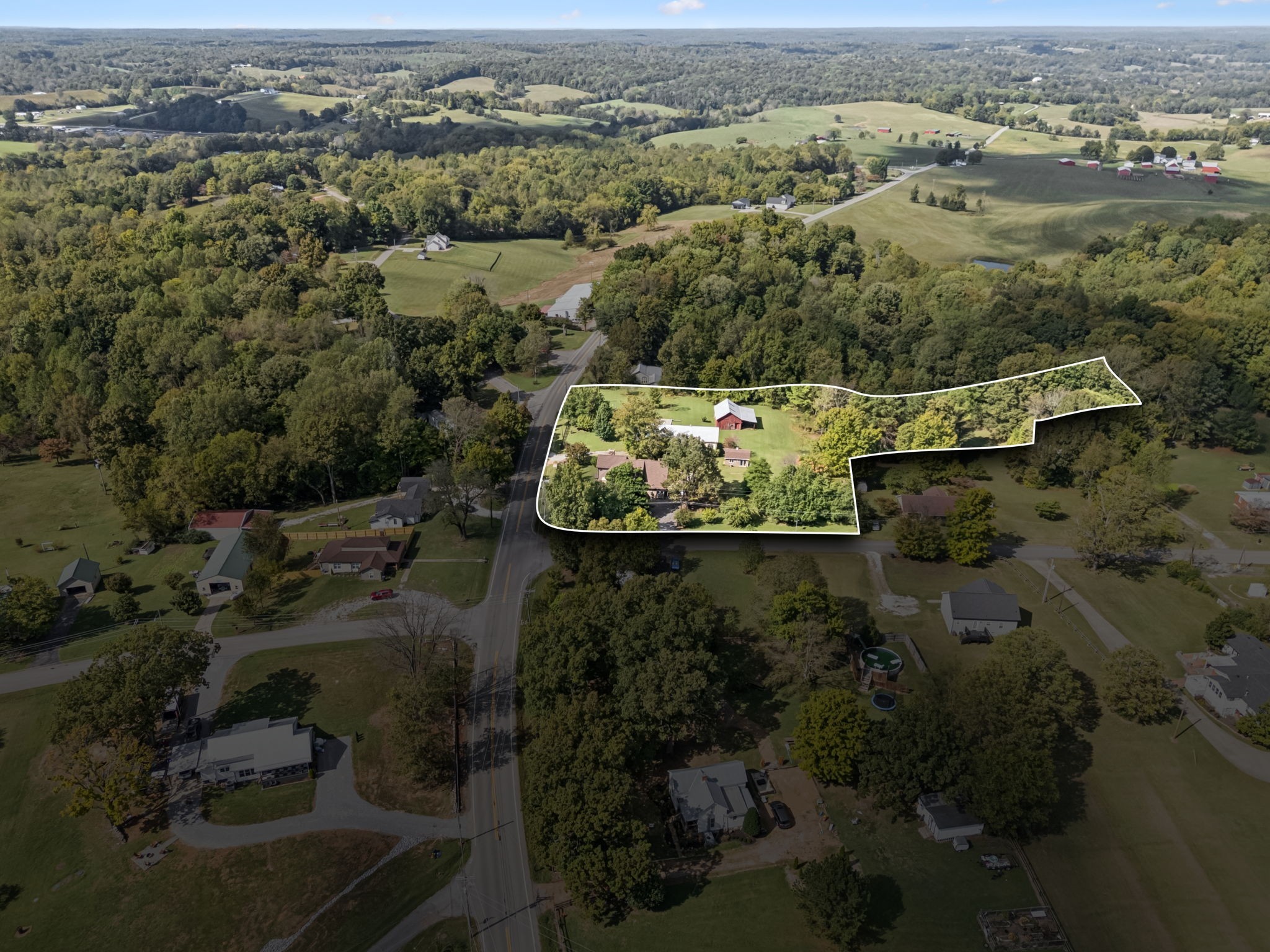 701 Hafner Road Charlotte, TN 37036 - Photo 14 of 52 an aerial view of a house with a yard