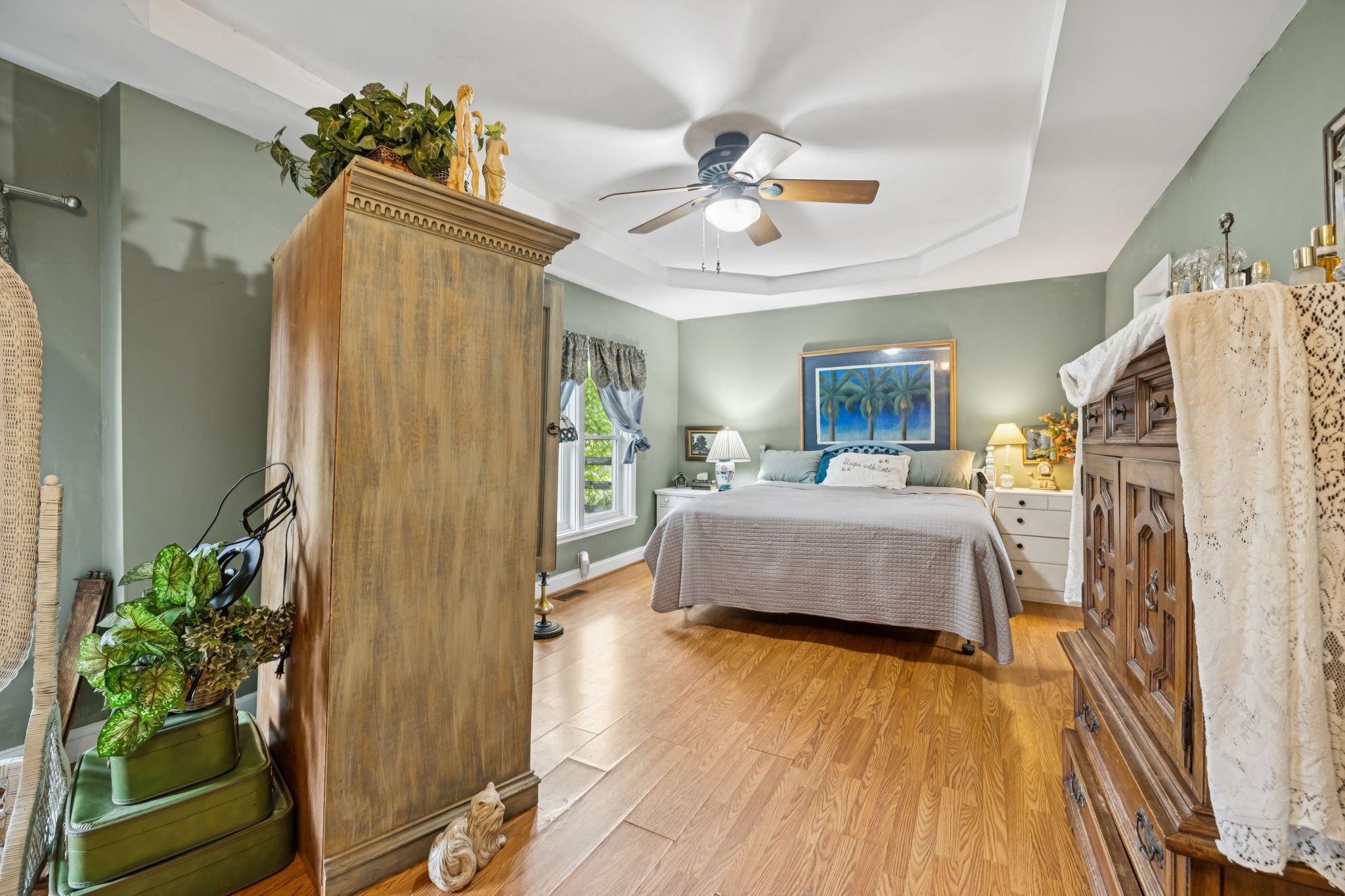 701 Hafner Road Charlotte, TN 37036 - Photo 28 of 52 a bedroom with a bed and a chandelier