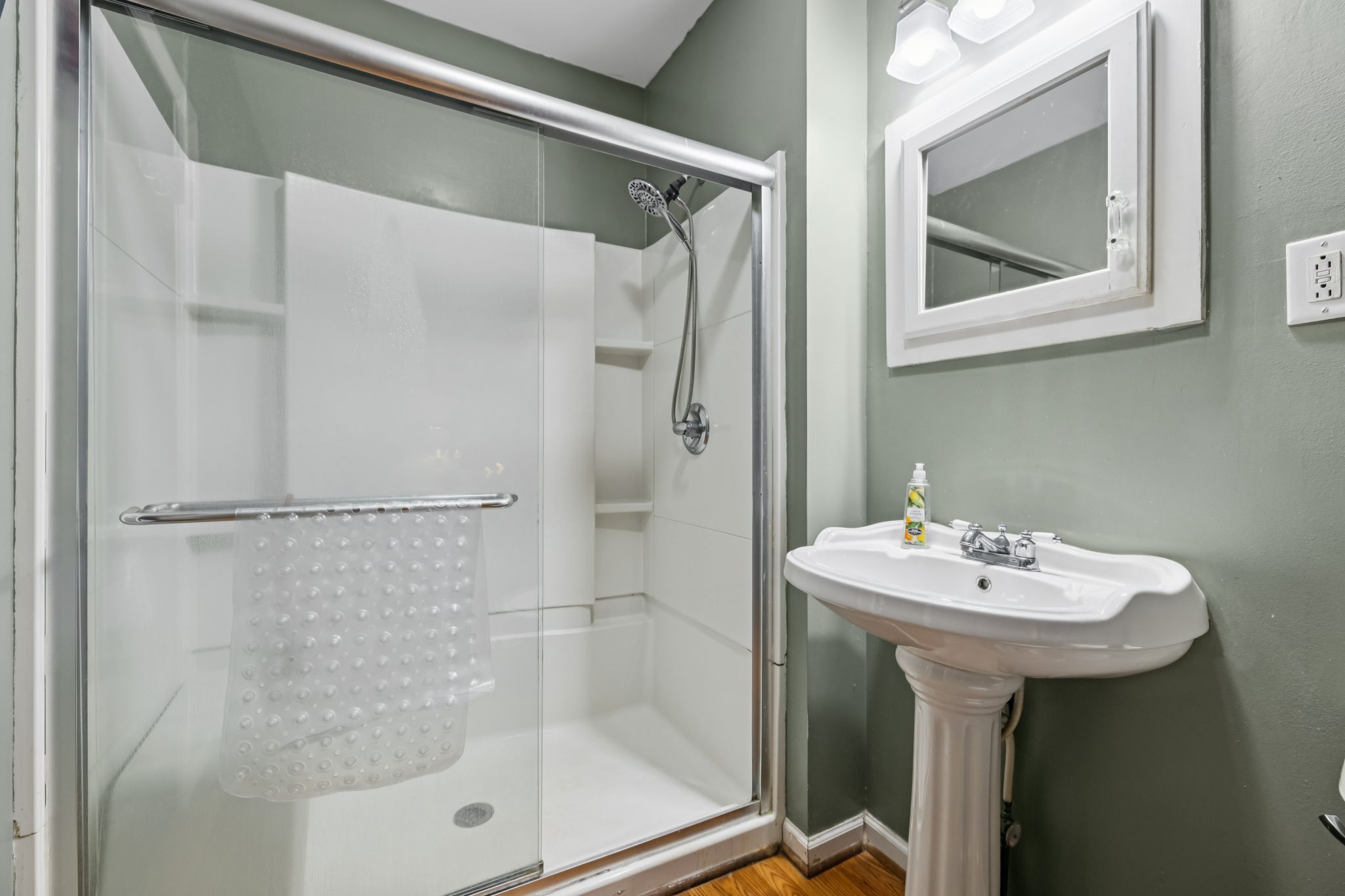 701 Hafner Road Charlotte, TN 37036 - Photo 30 of 52 a bathroom with a sink mirror and shower
